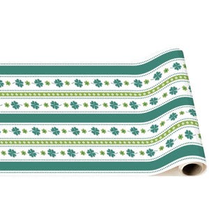 May include: A roll of green and white patterned table runner with a shamrock design. The runner is perfect for St. Patrick's Day or any Irish-themed event.