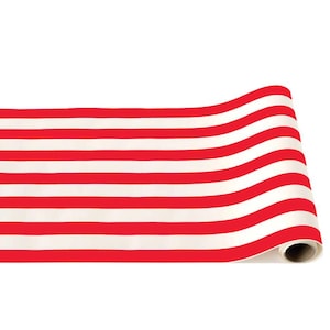 May include: Red and white striped table runner. The runner is rolled up and ready to be used.