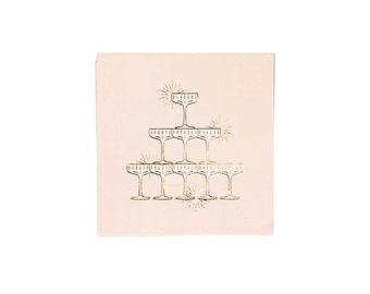 May include: Pink paper napkins with a gold foil design of a champagne glass pyramid.