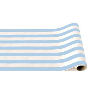 May include: A roll of paper with a repeating pattern of light blue and white horizontal stripes. The paper is partially unrolled, revealing the rolled edge. The stripes are evenly spaced and create a classic, nautical aesthetic.
