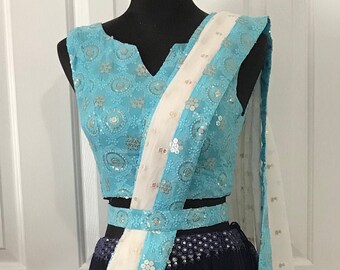 Chiffon lehenga choli in blue and sky blue color designed with resham and sequins work. Comes with white color dupatta.