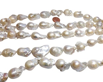 May include: Strands of lustrous, irregularly shaped, off-white baroque pearls. The pearls have a creamy, iridescent sheen and vary in size and form. The image shows multiple strands, suggesting a jewelry-making supply or finished necklace.