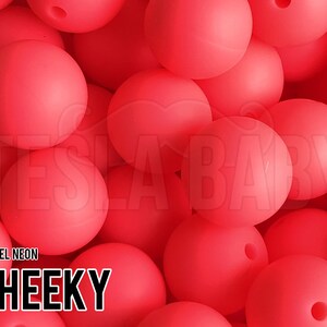 May include: A close-up of a pile of bright pink silicone beads. The beads are smooth and round, and they are perfect for making necklaces, bracelets, or other crafts. The text "PASTEL NEON CHEEKY" is visible in the lower left corner of the image.