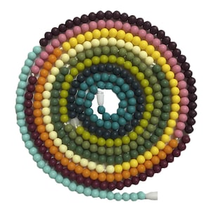 May include: A colorful string of beads with a variety of colors including teal, yellow, orange, pink, and burgundy.