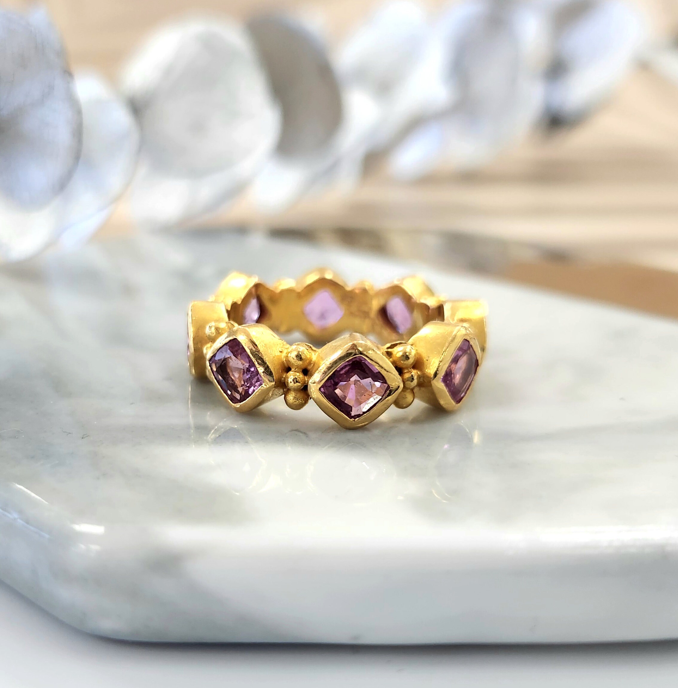 Pink sapphire eternity 2024 ring yellow gold
