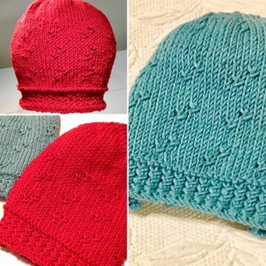 May include: Three knitted hats in different colors: red, blue, and gray. The hats have a textured pattern and a folded brim.
