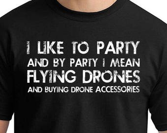 May include: Black t-shirt with white text that reads "I like to party and by party I mean flying drones and buying drone accessories".