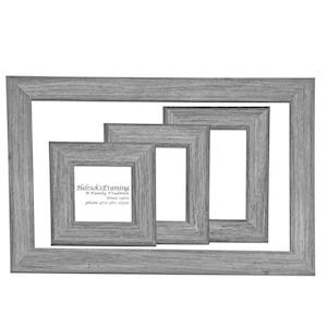 May include: Three gray picture frames of different sizes nested inside each other. The smallest frame has the text "Hedrick's Framing A Family Tradition Since 1992 phone 973-966-2889" printed inside.