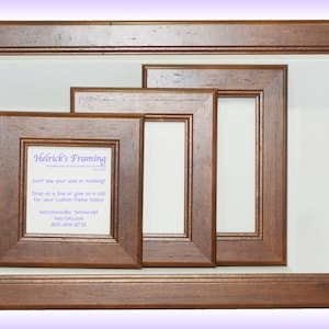 May include: Three wooden picture frames of different sizes, all in a dark brown wood tone. The smallest frame has a white background with text that reads "Helrick's Framing", "Don't see your size or molding?", "Drop us a line or give us a call", "For your custom frame today!", "helricksinco tonline.net", "Helricks.com", "800-659-8720".