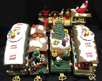 No.3962)  Christmas Tree Train, Engine, Coal Car, 3 Character Cars a Caboose and 4 track, Very Fine condition.