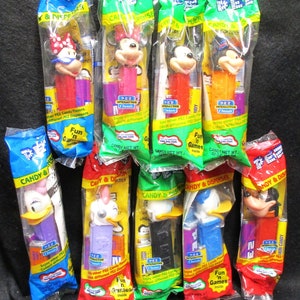 No.3956)  PEZ Set of 9, Disney, Different styles Vintage PEZ dispensers Very Fine to Mint condition.