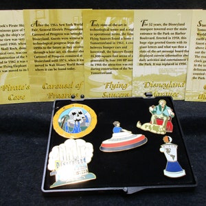 No.3840)  Disney Set of 5 Enameled Pins of Major Attractions at Disneyland Plus trading cards, Near Mint Condition.