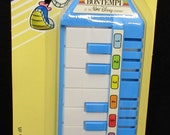 Set of 2 Disney Items, Keymonica and an 8 Key Piano, 20 years old. Mint. Cond. never Played with, Displayed or used. 2079a