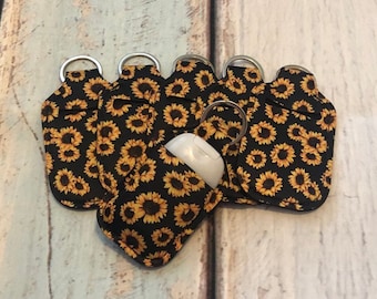 Black SUNFLOWER Print HAND SANITIZER Holder Key Chain Air Pod Case - Quantity One