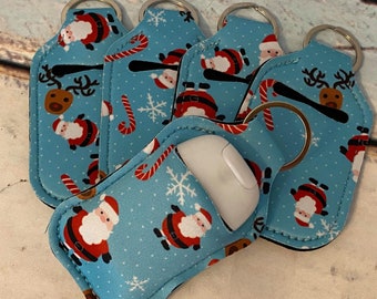 Blue Santa Clause ~ CHRISTMAS Print HAND SANITIZER Holder Key Chain Air Pod Case