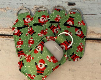 Green Santa Clause ~ CHRISTMAS Print HAND SANITIZER Holder Key Chain Air Pod Case