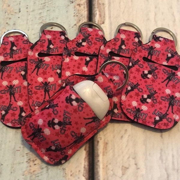 Pink CHEER Print HAND SANITIZER Holder Key Chain Air Pod Case - Quantity One