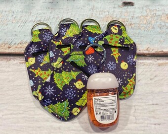Navy Blue with Christmas Trees ~ CHRISTMAS Print HAND SANITIZER Holder Key Chain Air Pod Case