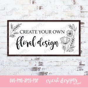 May include: A black and white sign with a wooden frame that reads "Create your own floral design". The sign is surrounded by a white brick wall.