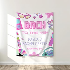 May include: White bachelorette party tapestry with pink and purple graphics. The text reads "BACH TO THE Y2K KAYLA'S BACHELORETTE TAMPA, FL". The design includes sunglasses, stars, flowers, a CD, and a cassette player.