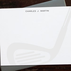 May include: White stationery with a grey golf club graphic and the text "CHARLES J. MARTIN" at the top.