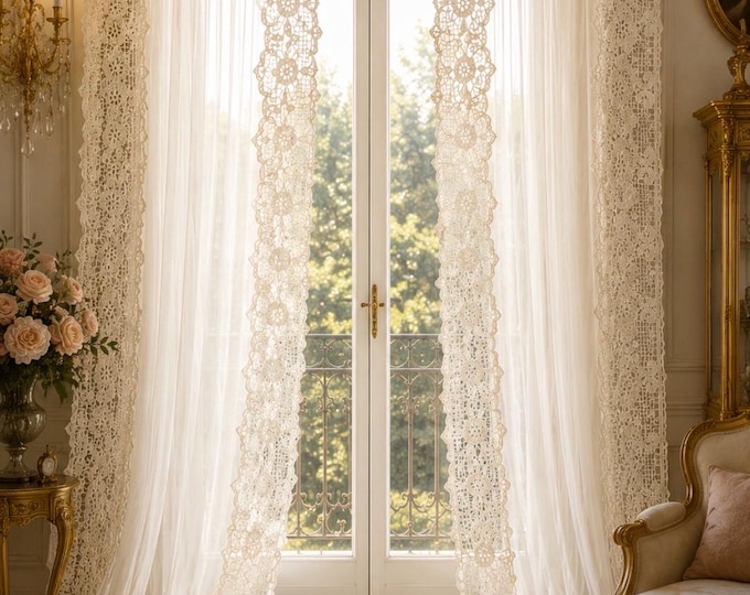 Amber tulle curtain with antique beige macramé lace from the “Le Trasparenze” collection.