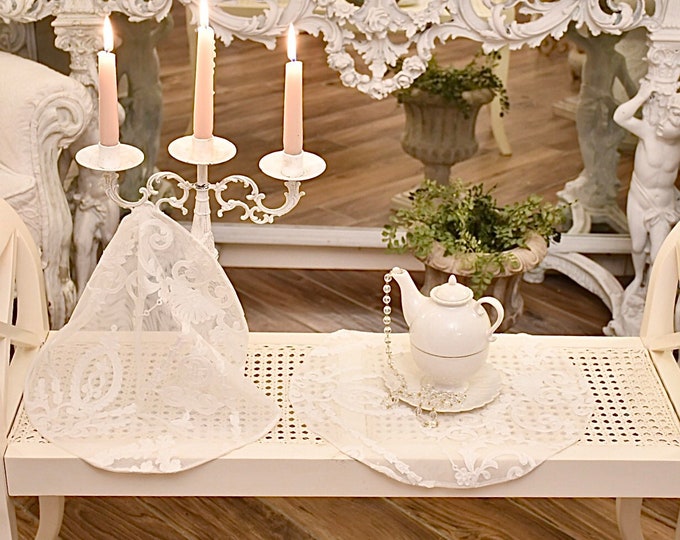 Shabby chic tulle doily decorated with “the Grotesques”