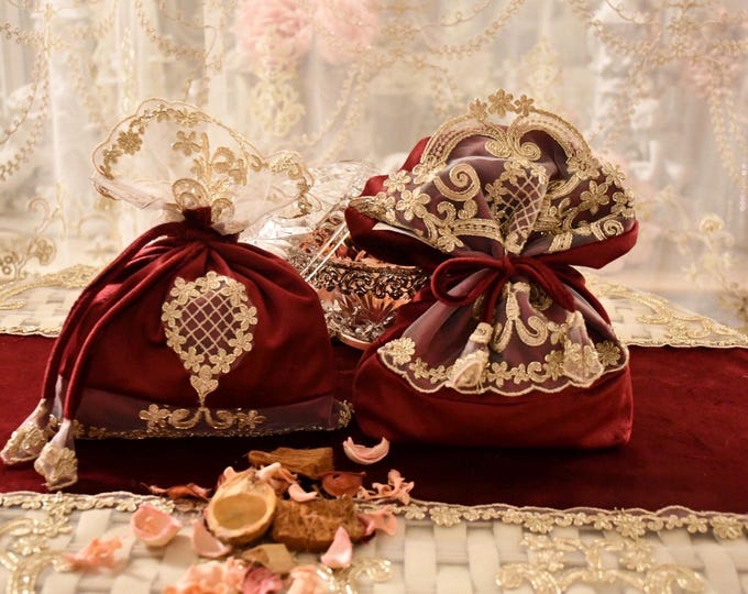 Pair of room fresheners in velvet and gold lace