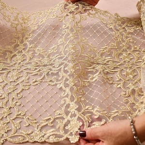 Meraviglioso tessuto in pizzo oro “Barocco”