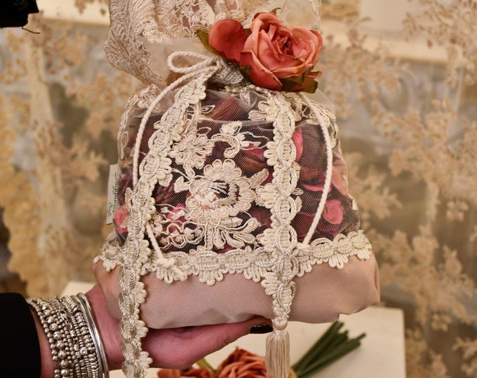 Bag of dried flowers and fine beige lace