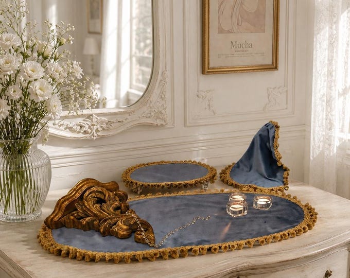 Trio of centerpieces from the "Duchess" collection, featuring fine blue velvet and antique gold trimmings.