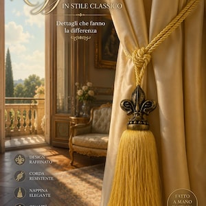 May include: A golden curtain tieback with a decorative tassel and a fleur-de-lis accent. The tieback is knotted around a cream-colored curtain. Text on the image reads "Reggitenda" and "IN STILE CLASSICO".