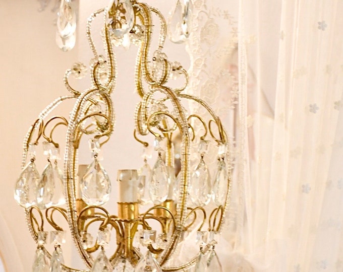 Antique 20th century brass and crystal chandelier, three lights