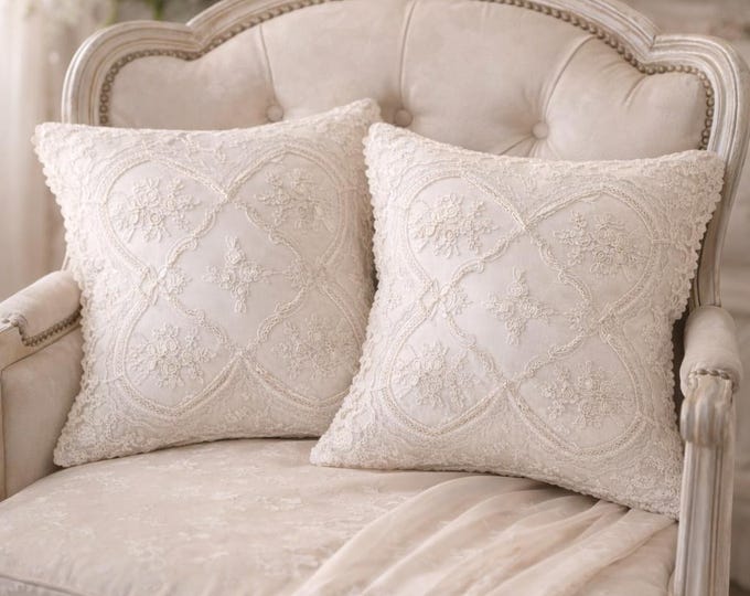 Romantic cushion in ivory silk satin with rebrodé lace with light gold threads.