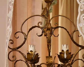Beautiful wrought iron chandelier of the twentieth century bronze gold