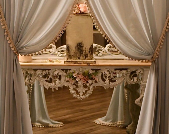 Pair of curtains in pure Italian georgette in powder blue with precious trimmings