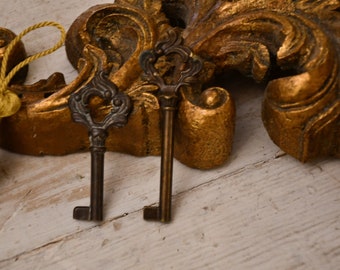 20th century Italian burnished brass key with volute