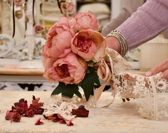 Bouquet of peonies with silk and lace