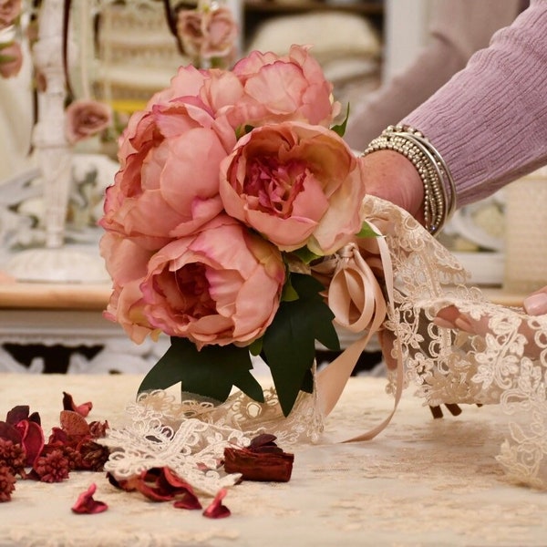 Bouquet of peonies with silk and lace