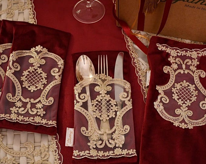Elegant and refined cutlery holders in velvet and gold lace