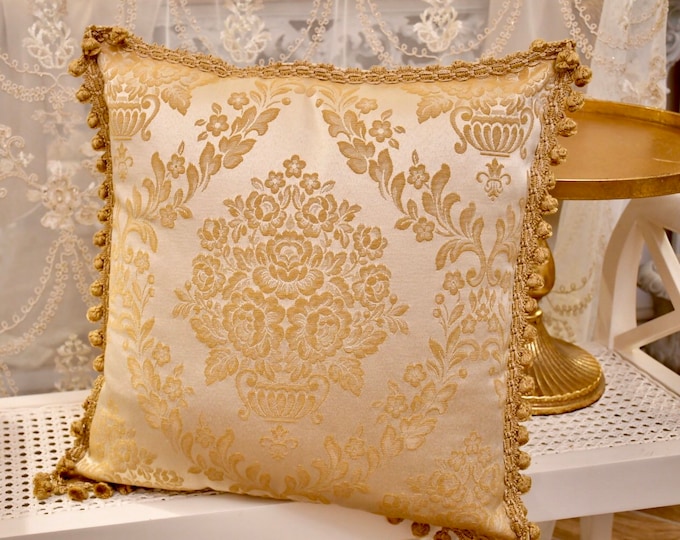 Damask gold cushion and fine trimmings