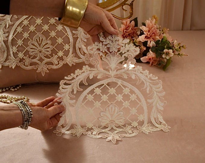 “Sofia” tablecloth in pearl white and pink embroidered lace. Faggianis decorative doily.