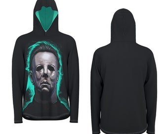 May include: Black hooded sweatshirt featuring a portrait of a character with a white mask and teal accents. The front view shows the character's face, while the back view is plain black. The hood has a teal lining.
