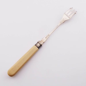 A good vintage silver plated Pickle Fork with sterling silver collar