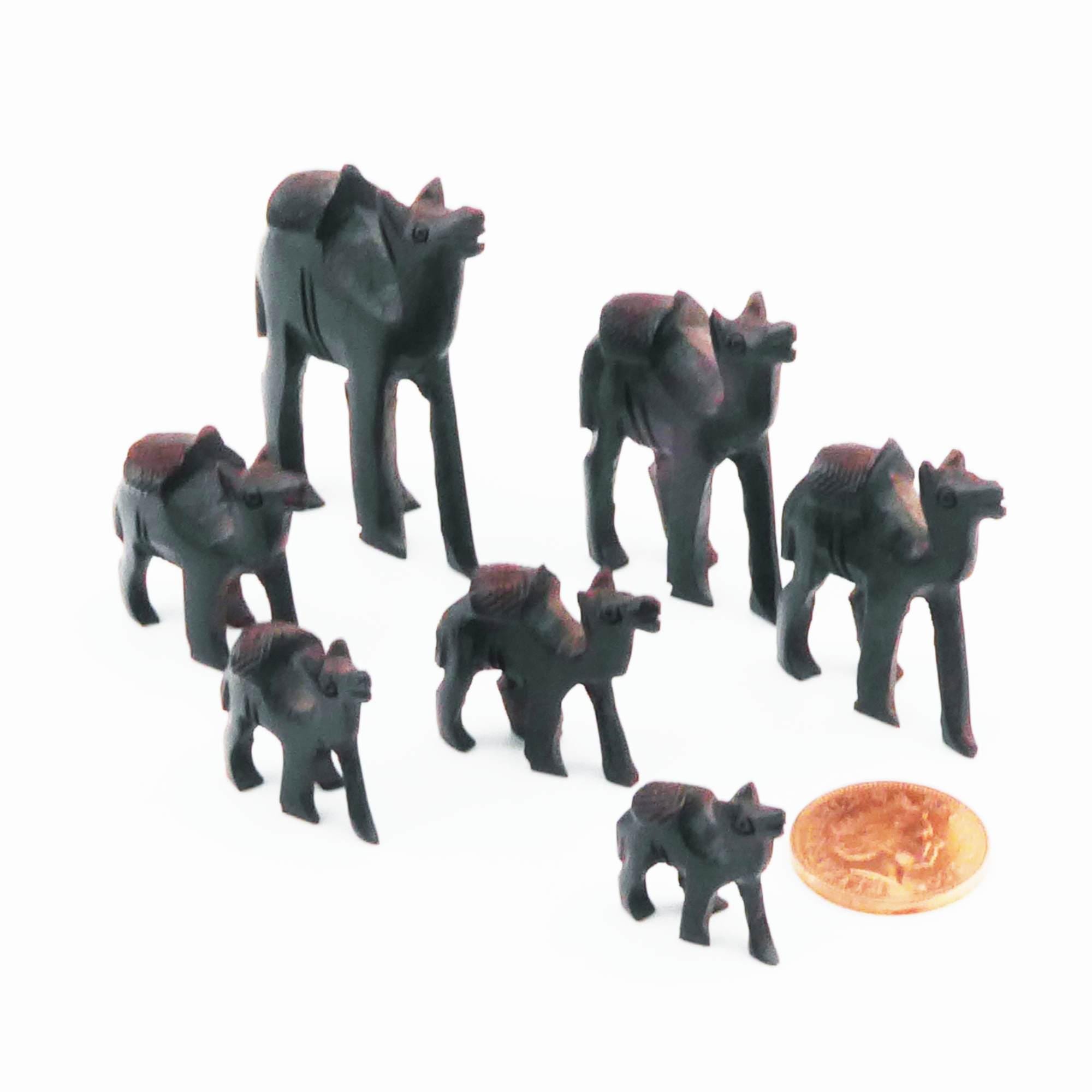 Seven tiny vintage carved wooden camels