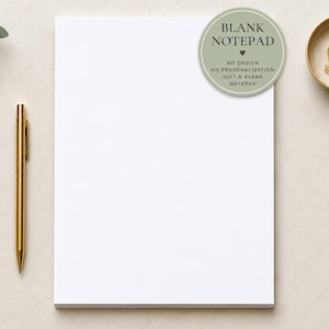 May include: A rectangular white notepad with a circular sage green sticker in the top right corner containing the text BLANK NOTEPAD, NO DESIGN, NO PERSONALIZATION, JUST A BLANK NOTEPAD. A gold pen is positioned to the left of the notepad.