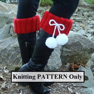May include: Knitting pattern for red boot cuffs with white pom poms and a bow. The pattern is for knitting only, not a finished product.