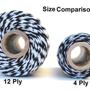 May include: Size comparison of two spools of black and white baker's twine. The larger spool is labeled "12 Ply" and the smaller spool is labeled "4 Ply".