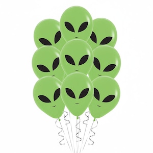 May include: A cluster of green alien-faced balloons with black eyes and a smiling mouth. The balloons are tied with silver curling ribbon, perfect for a space-themed party or event.