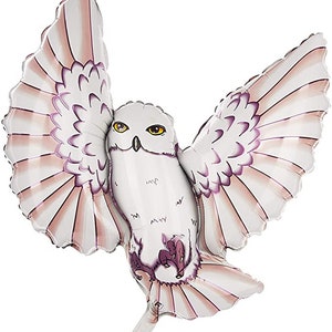 May include: A white owl-shaped balloon with outstretched wings. The balloon features detailed feather patterns in shades of white, pink, and purple. The owl has yellow eyes and a beak, and is designed to appear as if it is in flight.